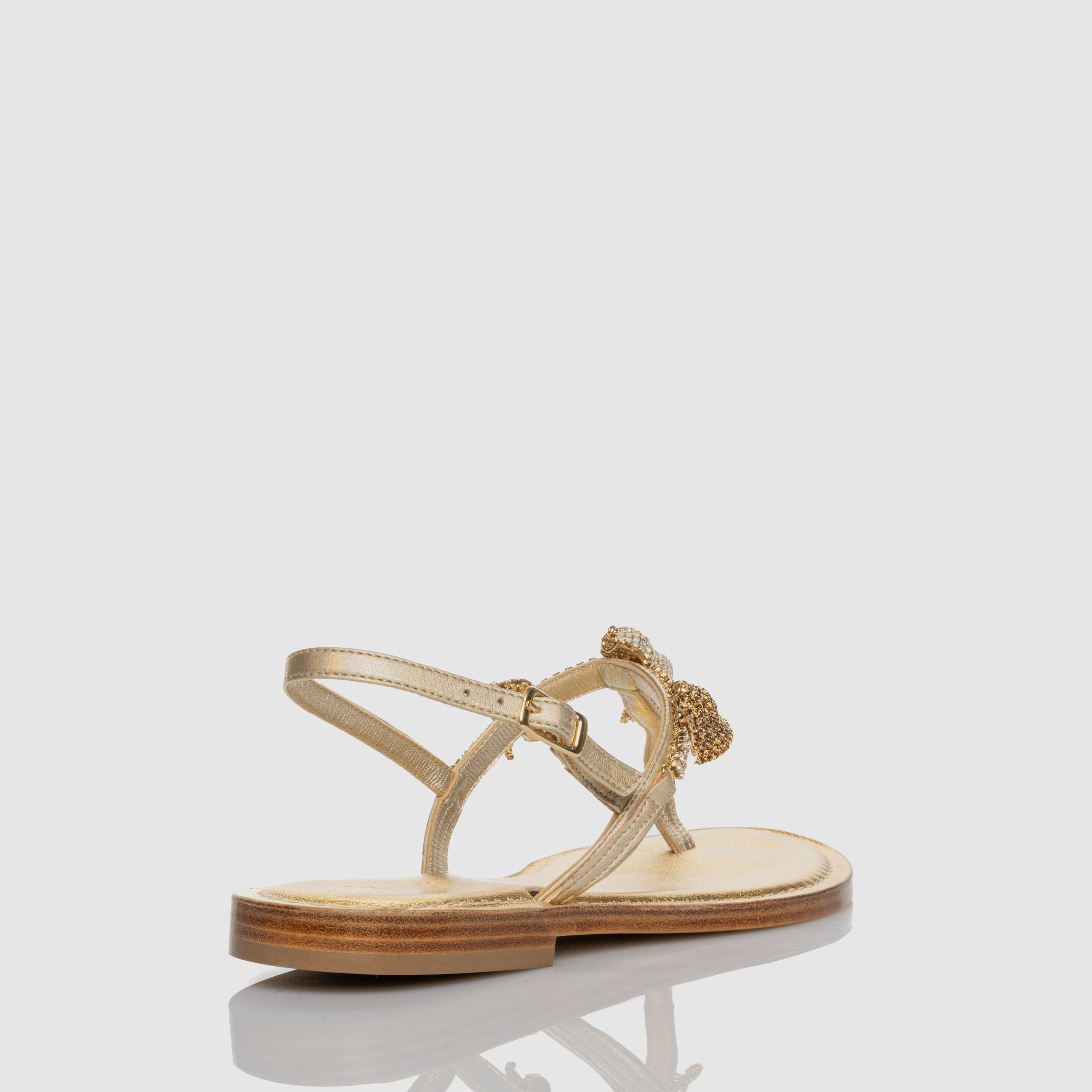 Capri Bells Gold thong sandal in Nappa leather with Capri bell charm